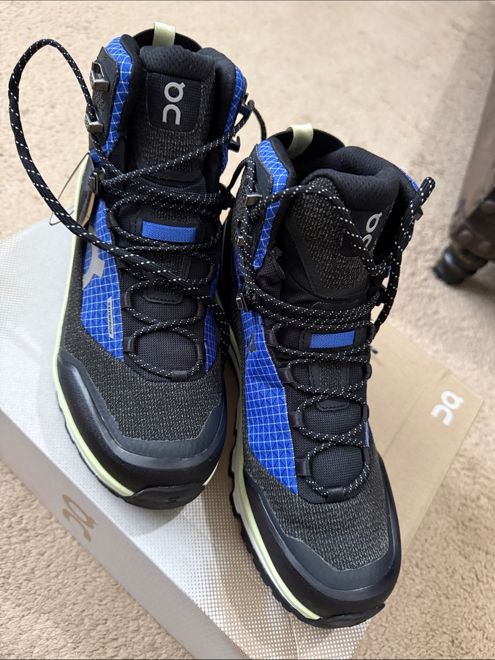 On Running Black Trail Shoes with Blue Panels and Lime Accent